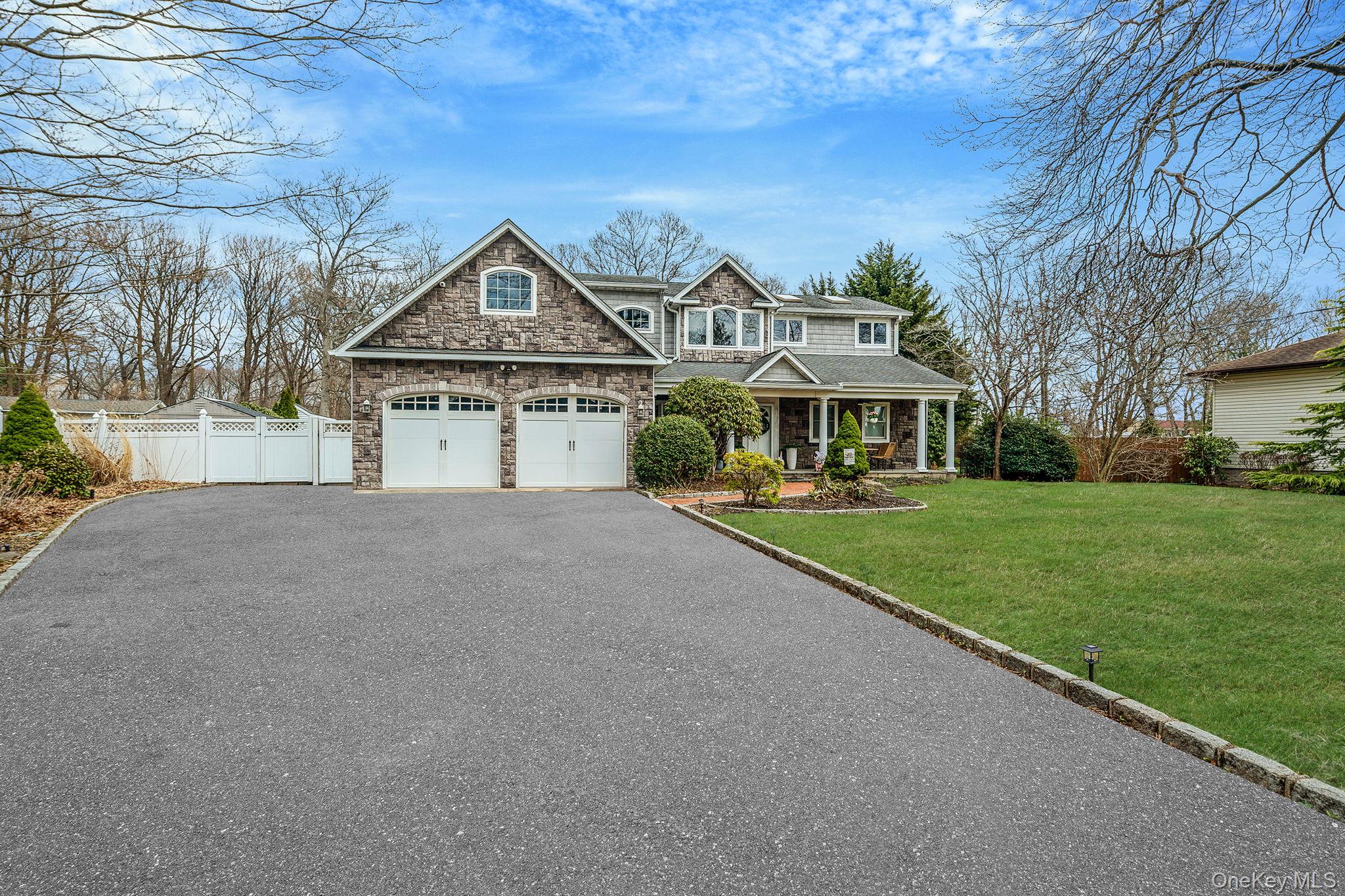 23 Wylde Road Mount Sinai, NY 11766 - Photo 2 of 45 a front view of a house with garden