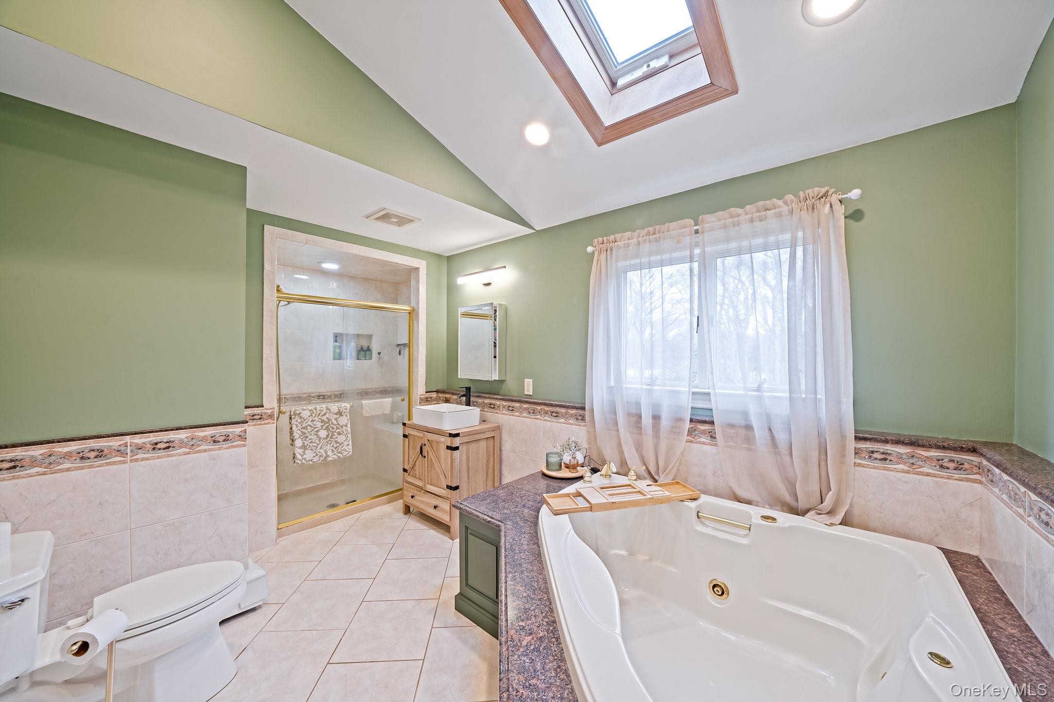 23 Wylde Road Mount Sinai, NY 11766 - Photo 23 of 45 a bathroom with a tub sink and mirror