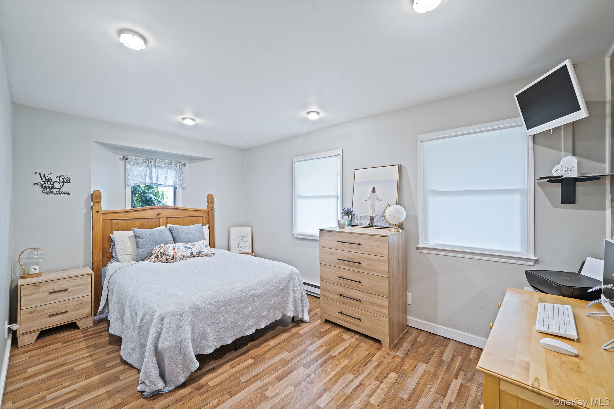 23 Wylde Road Mount Sinai, NY 11766 - Photo 27 of 45 a bedroom with a bed and a dresser