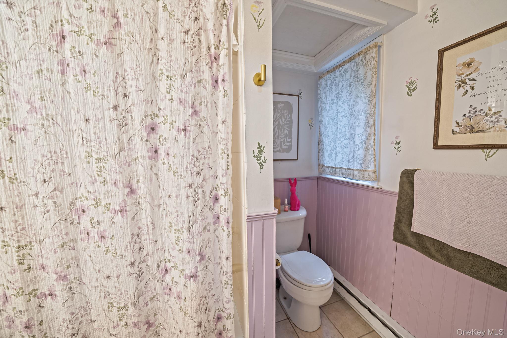 23 Wylde Road Mount Sinai, NY 11766 - Photo 29 of 45 a white toilet sitting next to a shower curtain