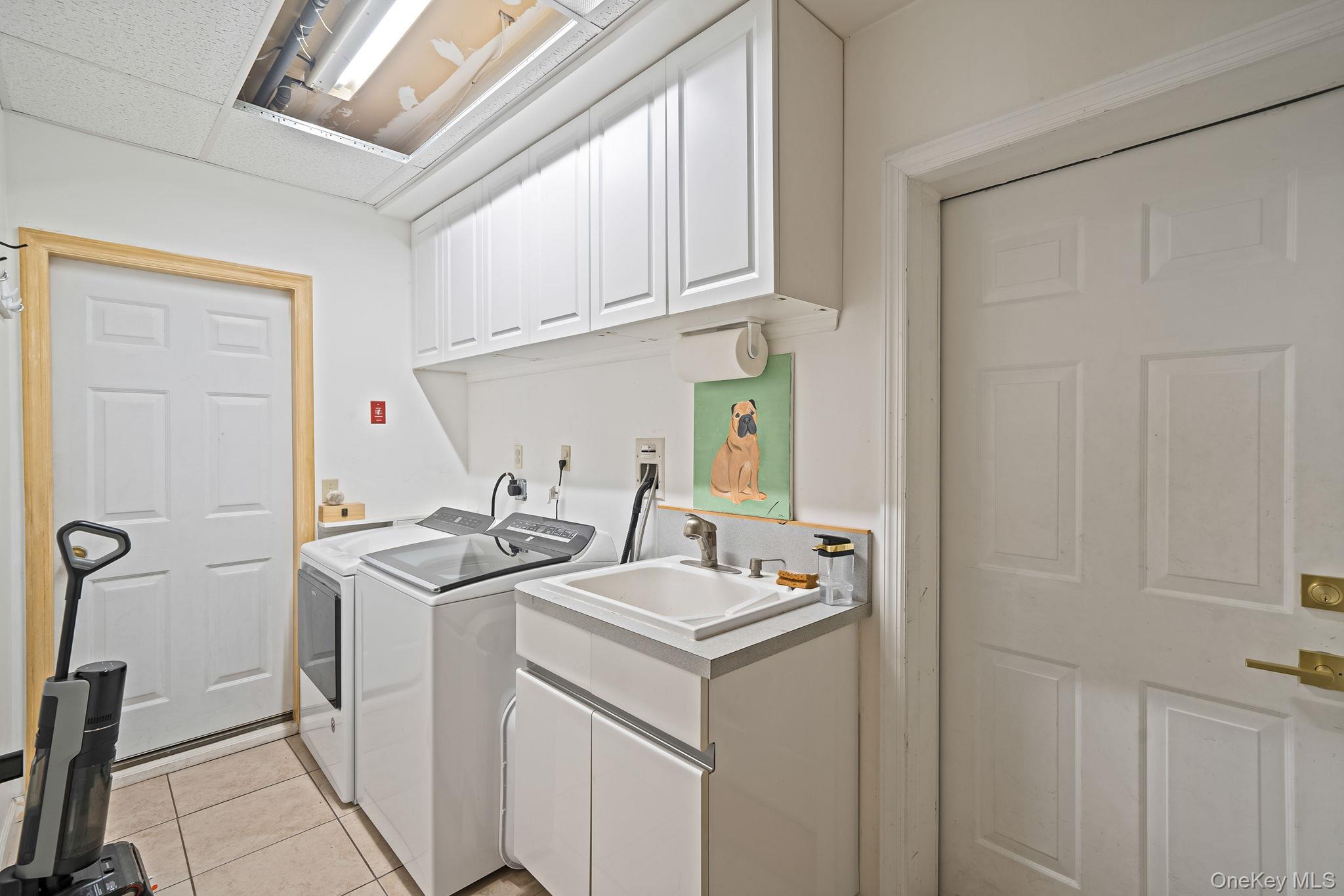 23 Wylde Road Mount Sinai, NY 11766 - Photo 31 of 45 a utility room with dryer and washer