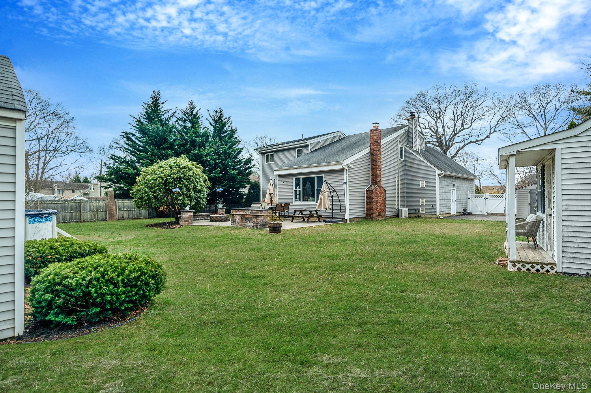 23 Wylde Road Mount Sinai, NY 11766 - Photo 40 of 45 a view of house with backyard
