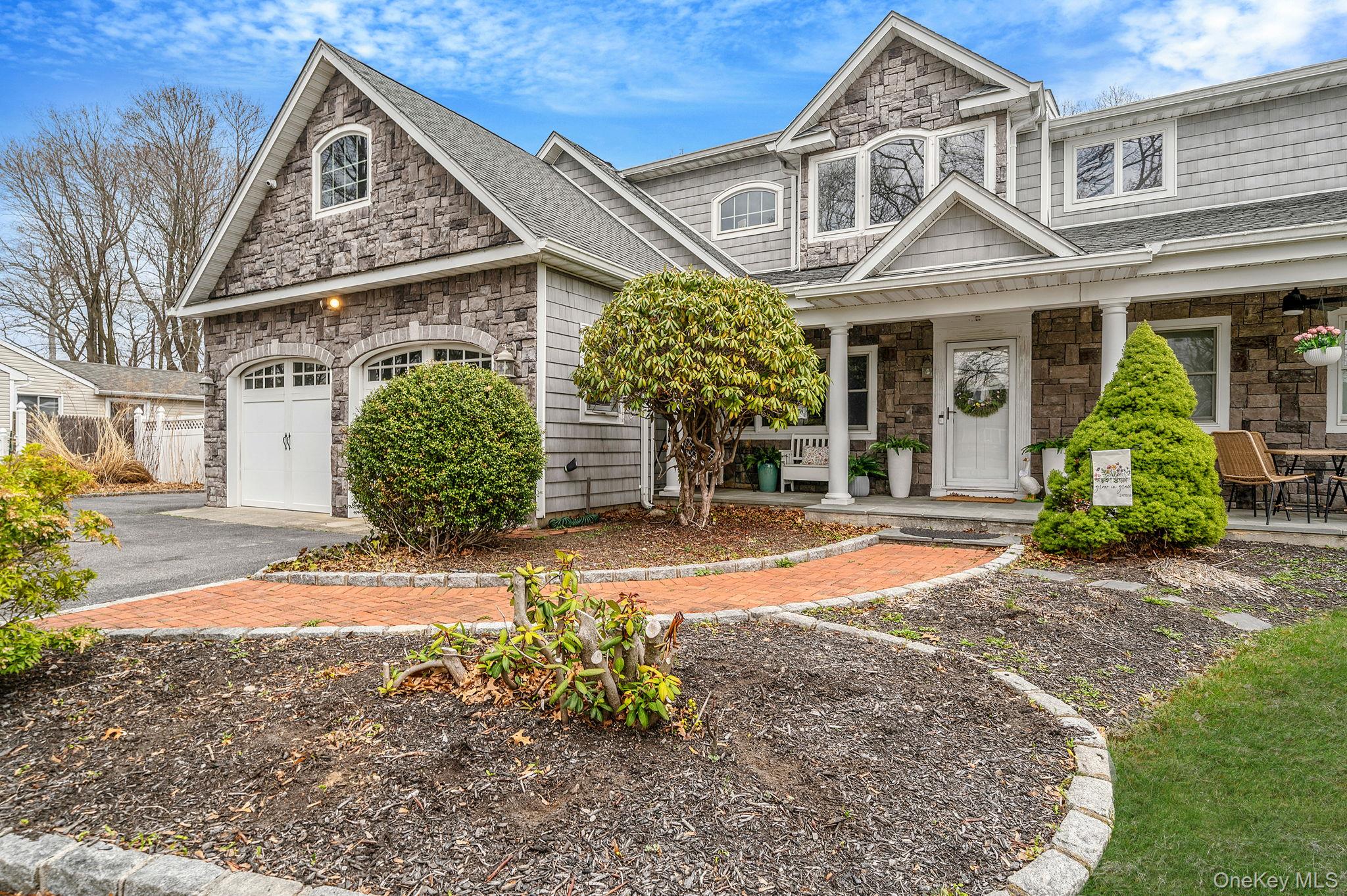 23 Wylde Road Mount Sinai, NY 11766 - Photo 4 of 45 front view of a house with a yard