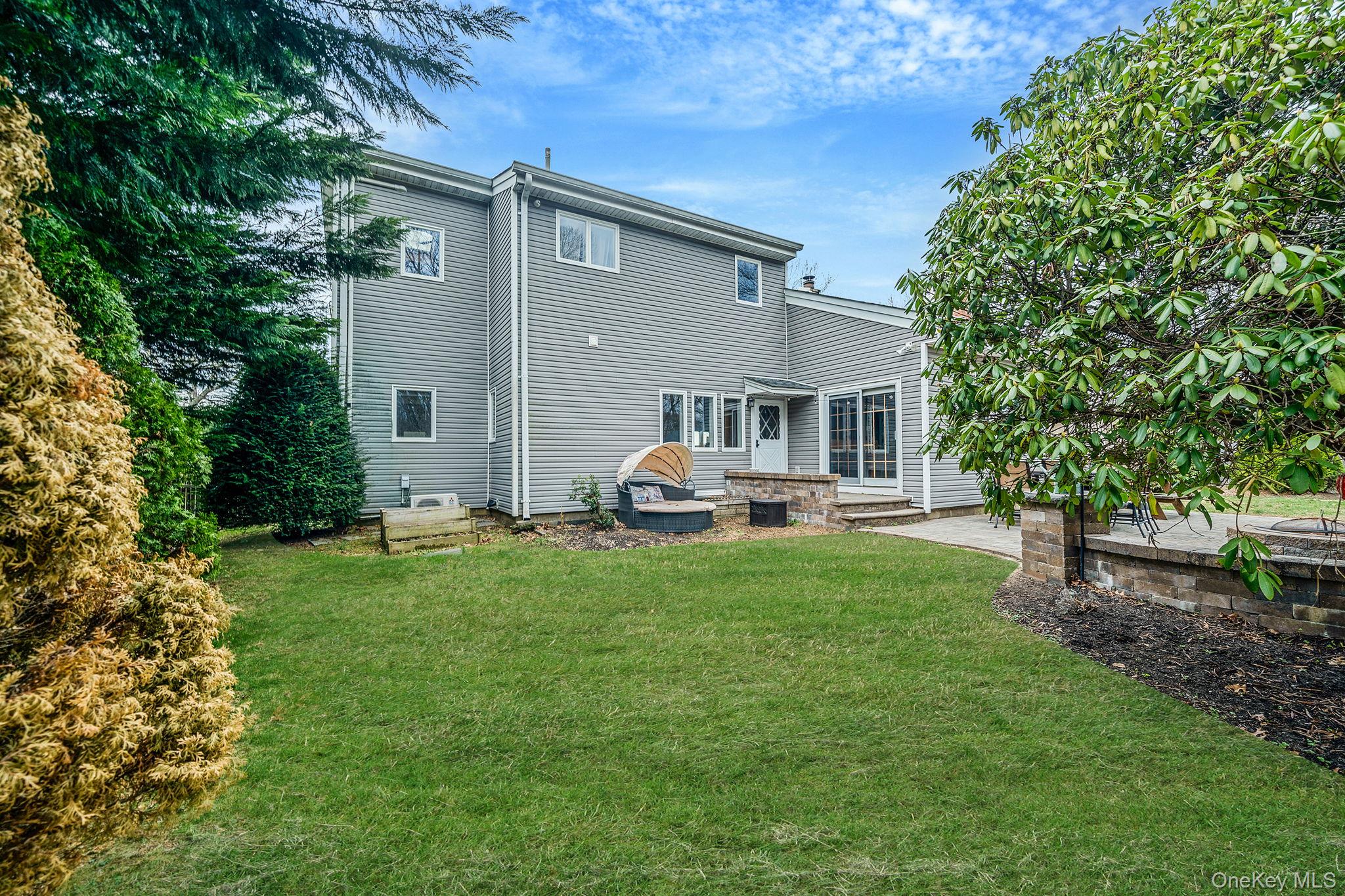 23 Wylde Road Mount Sinai, NY 11766 - Photo 45 of 45 a front view of house with yard barbeque oven and green space