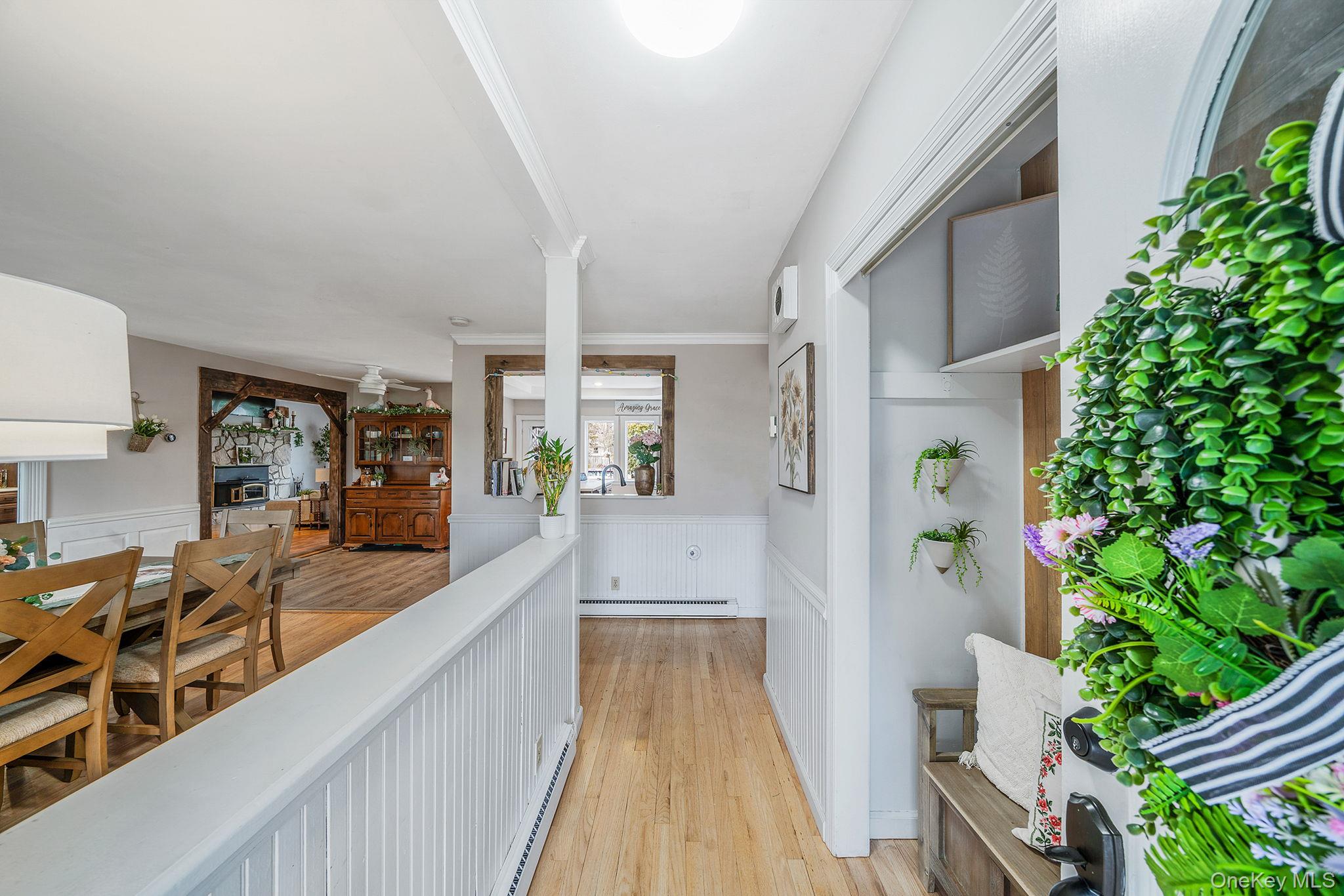 23 Wylde Road Mount Sinai, NY 11766 - Photo 6 of 45 a view of a living room and entryway
