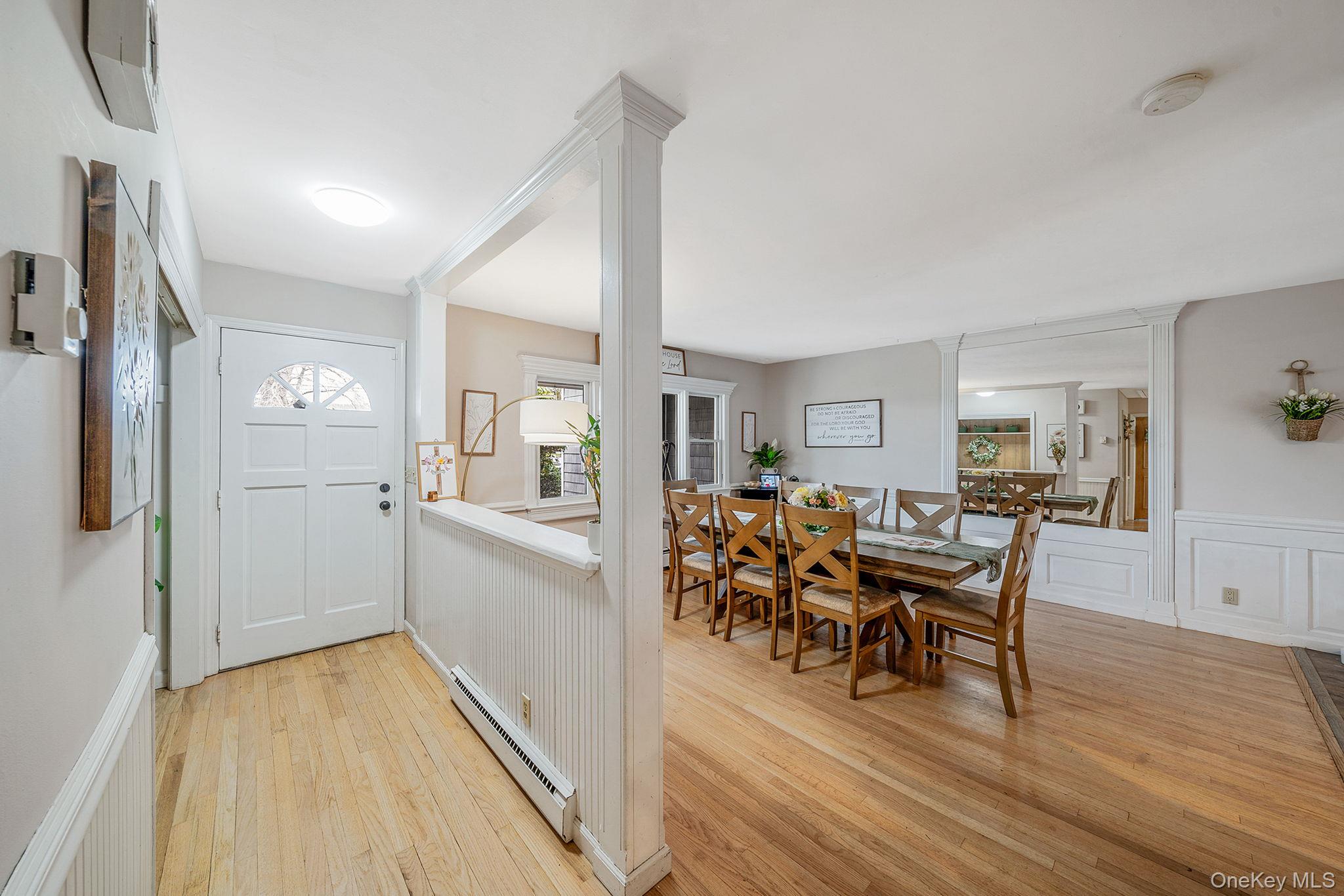23 Wylde Road Mount Sinai, NY 11766 - Photo 7 of 45 a view of a dining room with furniture and wooden floor