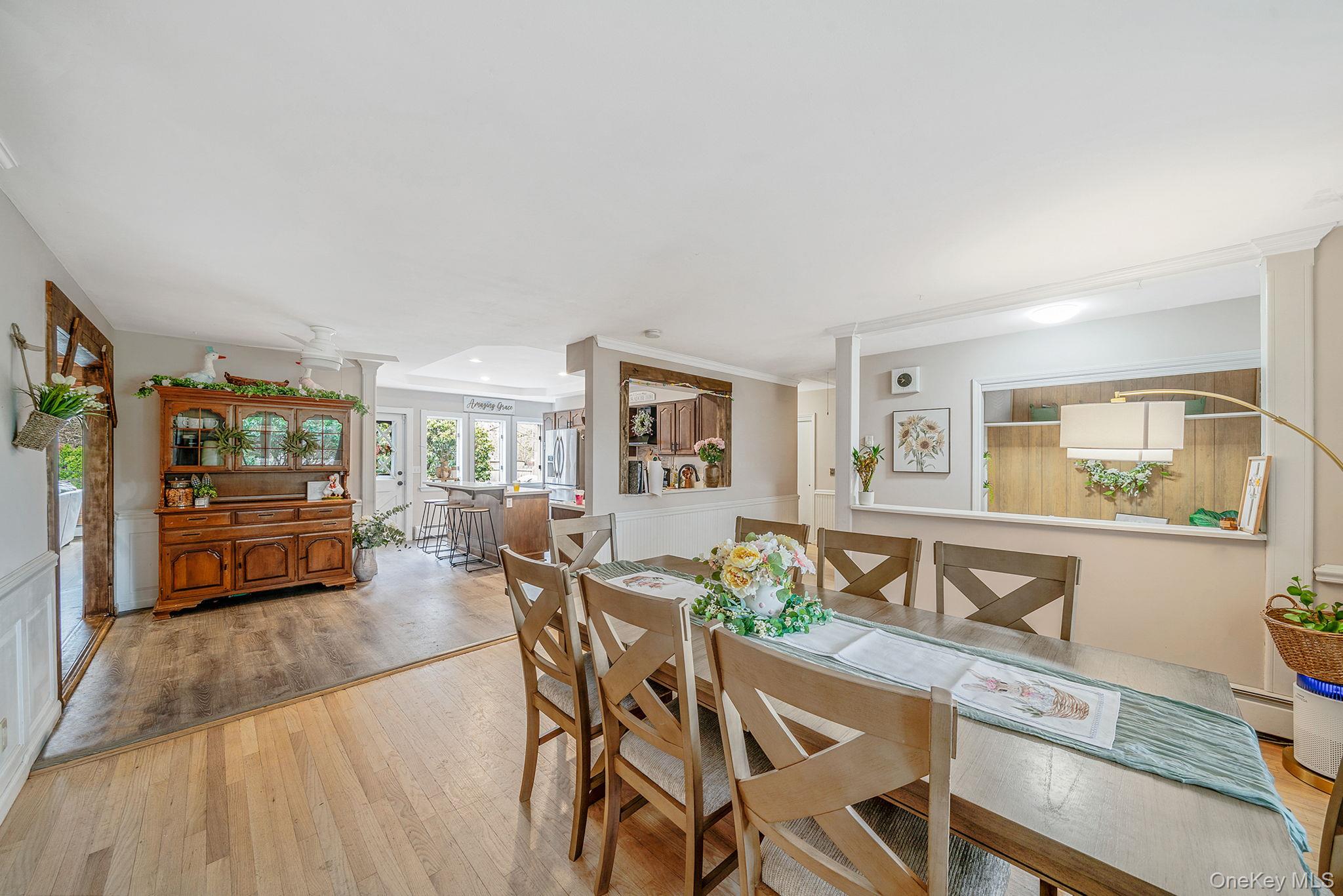23 Wylde Road Mount Sinai, NY 11766 - Photo 9 of 45 a view of a dining room with furniture and chandelier