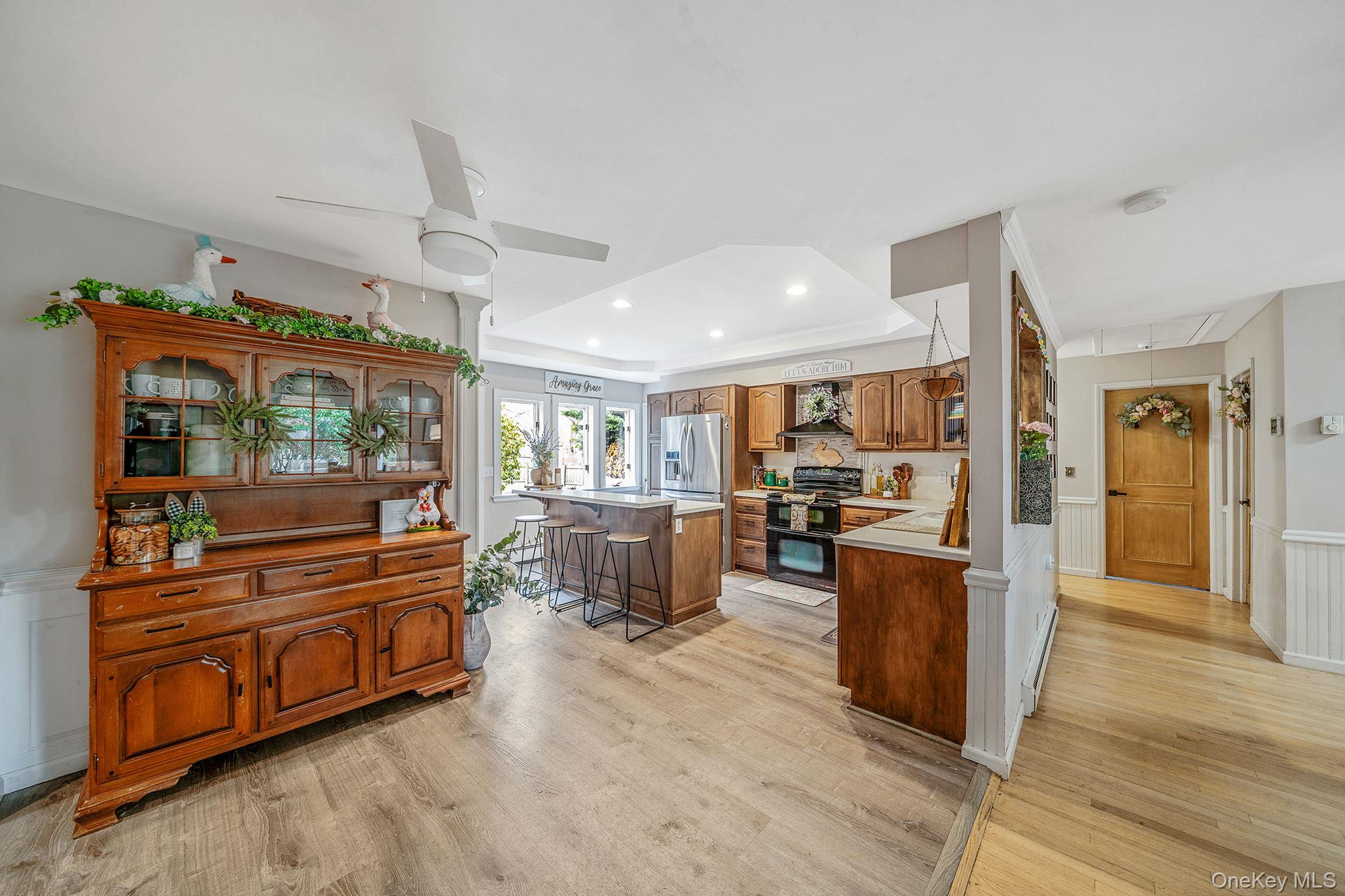 23 Wylde Road Mount Sinai, NY 11766 - Photo 10 of 45 a living room with furniture and a flat screen tv