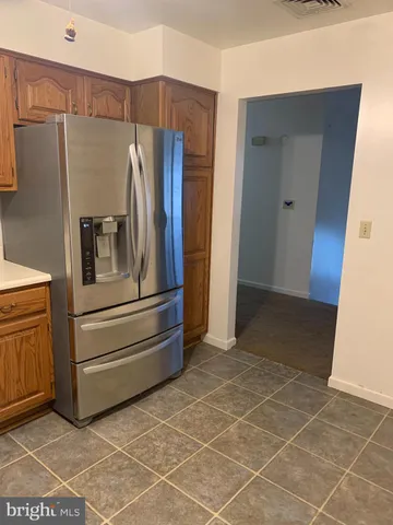 a kitchen with a sink a stove and cabinets
