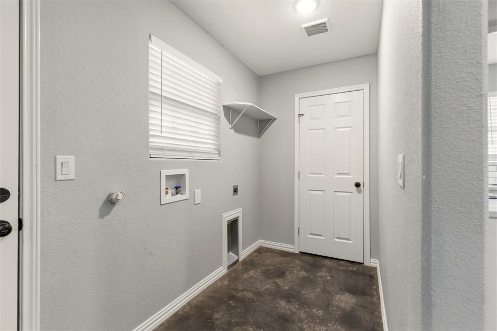 933 Rice Street Denison, TX 75020 - Photo 15 of 19 a view of a bathroom from the hallway