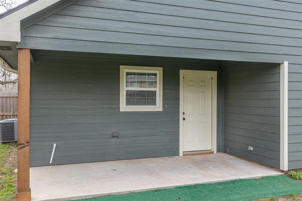 933 Rice Street Denison, TX 75020 - Photo 16 of 19 a view of front door