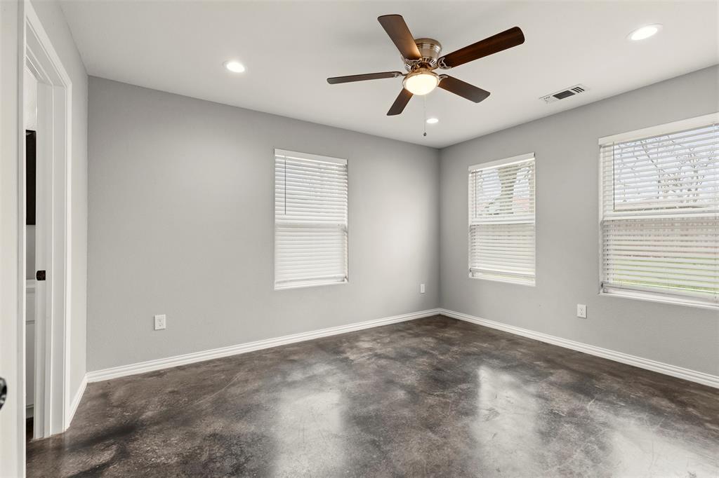 933 Rice Street Denison, TX 75020 - Photo 7 of 19 a view of a livingroom with a ceiling fan and window