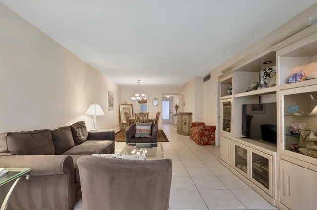 a living room with furniture and flat screen tv