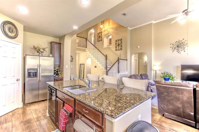 a living room with a table and chairs