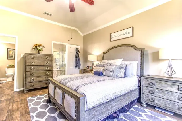 a bedroom with a bed and a dresser