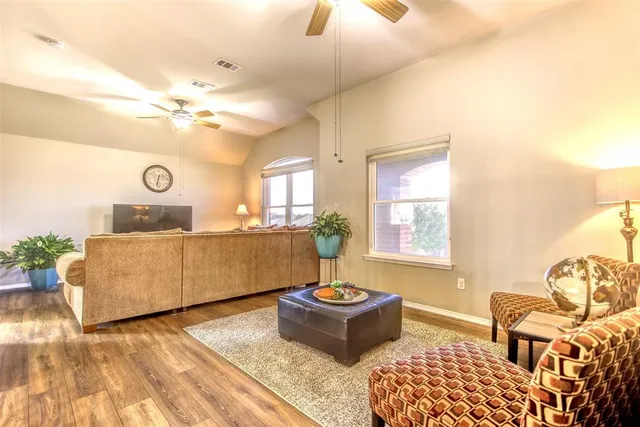 a living room with furniture and a table