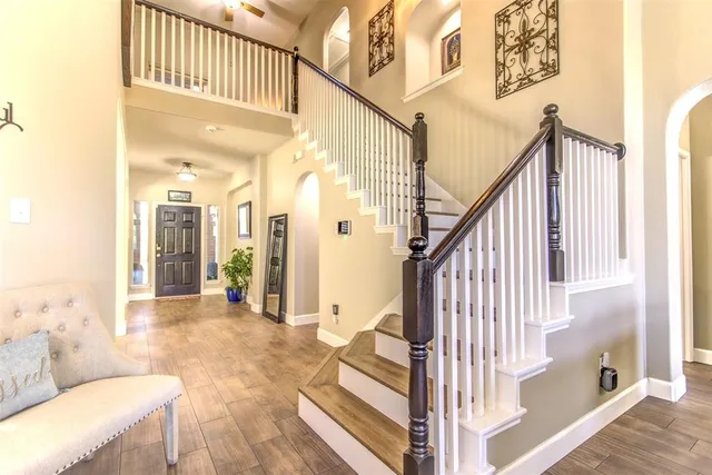 a view of an entryway with wooden floor