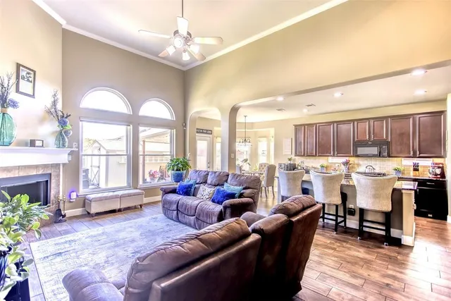 a living room with lots of furniture and a large window
