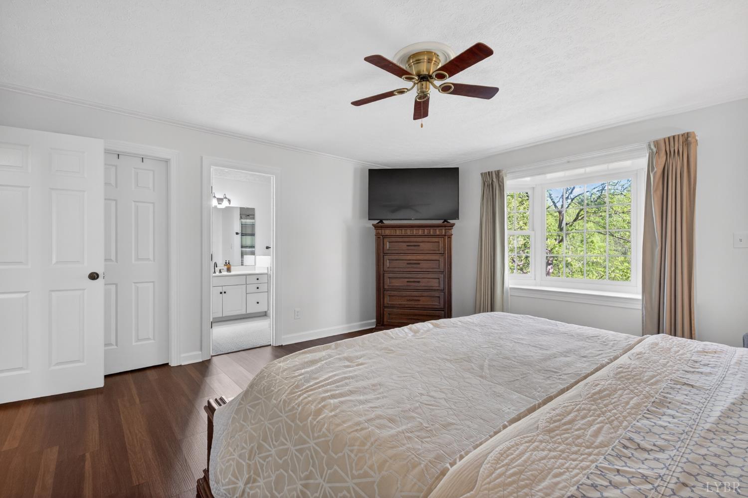 316 Quail Ridge Drive Forest, VA 24551 - Photo 15 of 35 a bedroom with a large bed and a window