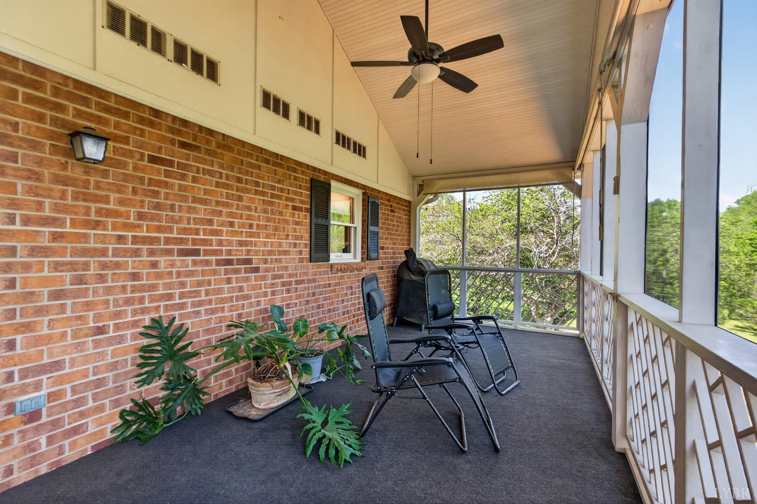 316 Quail Ridge Drive Forest, VA 24551 - Photo 25 of 35 a view of a patio with a table and chairs under an umbrella