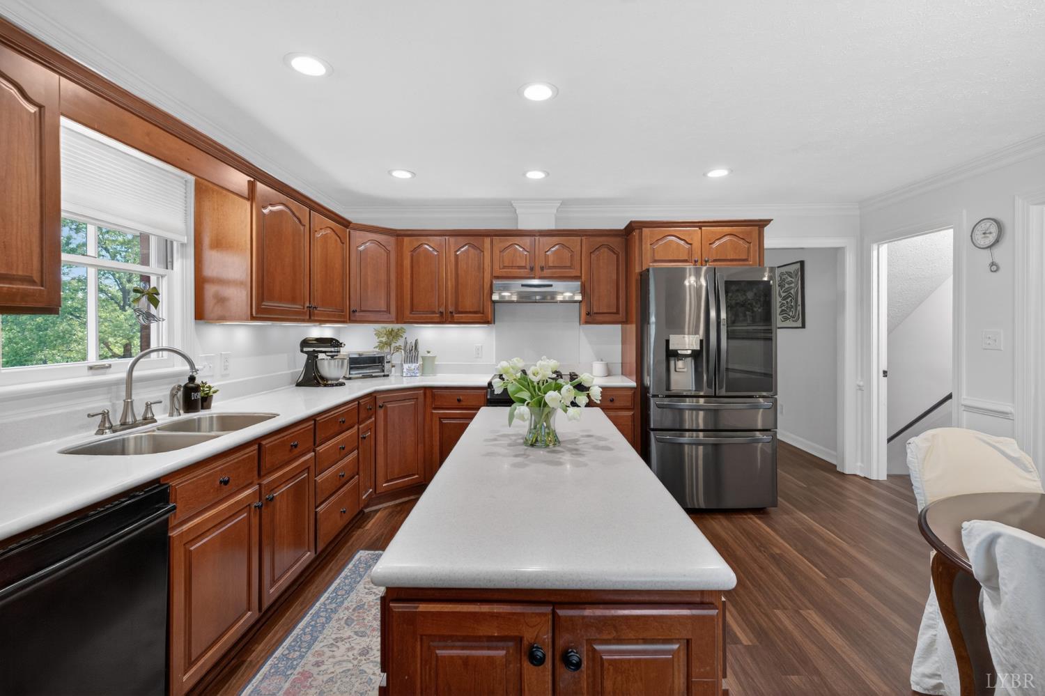 316 Quail Ridge Drive Forest, VA 24551 - Photo 3 of 35 a kitchen with stainless steel appliances granite countertop a sink a stove a refrigerator cabinets and a dining table