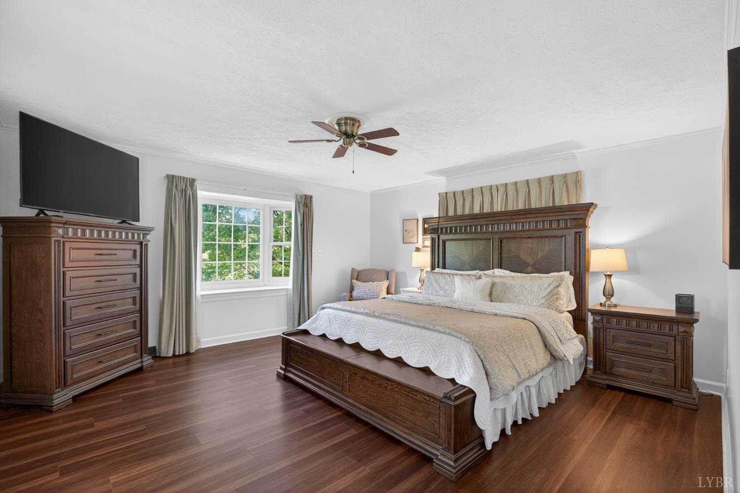 316 Quail Ridge Drive Forest, VA 24551 - Photo 5 of 35 a bedroom with a bed and a flat screen tv