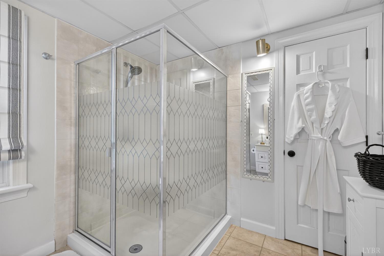 316 Quail Ridge Drive Forest, VA 24551 - Photo 6 of 35 a bathroom with a glass shower door