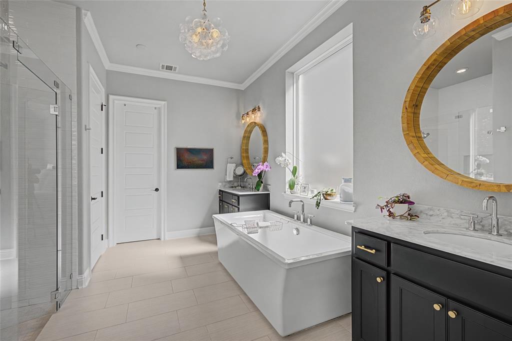 13753 Green Elm Road Fort Worth, TX 76008 - Photo 22 of 40 En-suite primary bath has individual vanities with hidden under counter plugs for personal appliances.