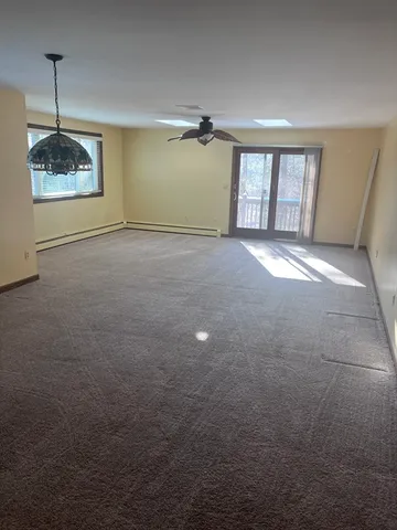 a view of empty room with windows