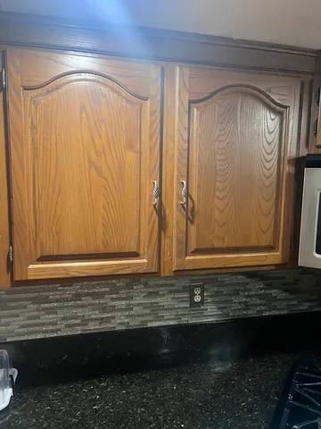 a view of door with wooden door