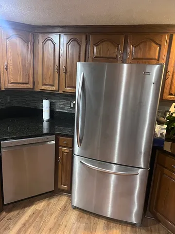 a close view of a refrigerator a stove a microwave and a refrigerator