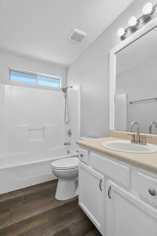 a bathroom with a sink a toilet and a bathtub