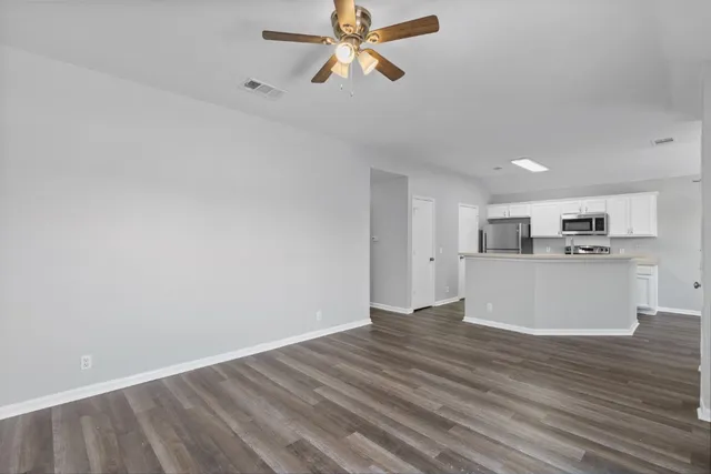 a view of cabinets and wooden floor