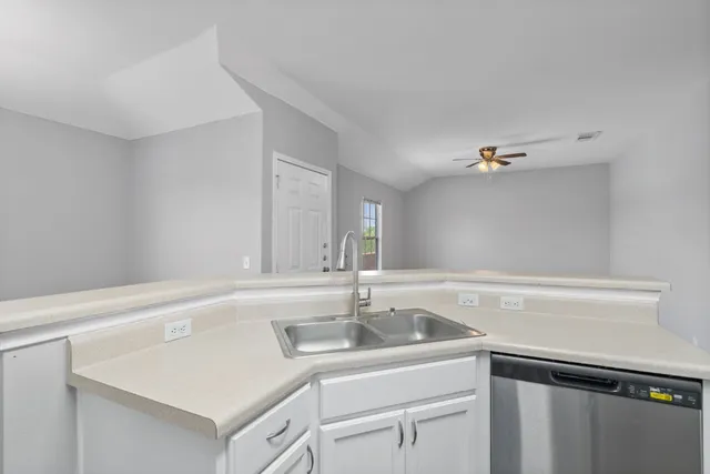 a view with a sink and cabinets