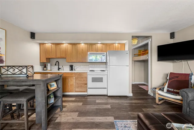 a kitchen with stainless steel appliances granite countertop a stove and a sink