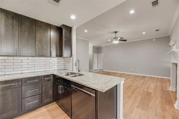 a kitchen with a sink vanity and cabinets