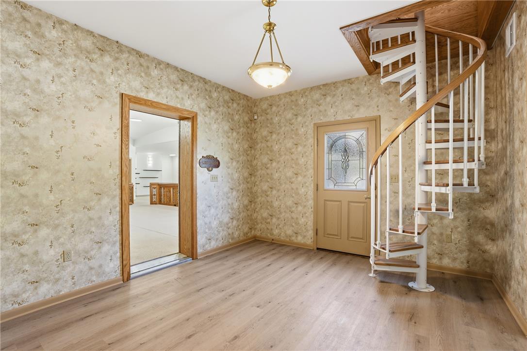 6271 Batman Road Zionsville, PA 18092 - Photo 34 of 100 A charming entryway presents durable flooring and a captivating spiral staircase.