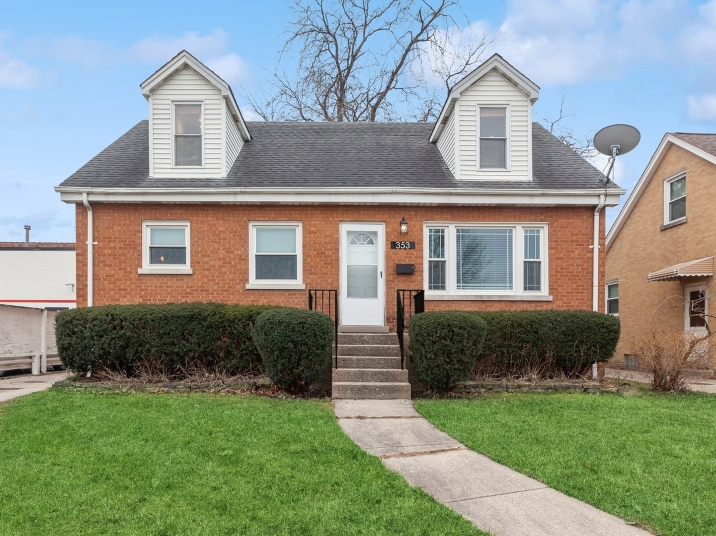 353 East Quincy Street Riverside, IL 60546 - Photo 1 of 21 a front view of a house with garden