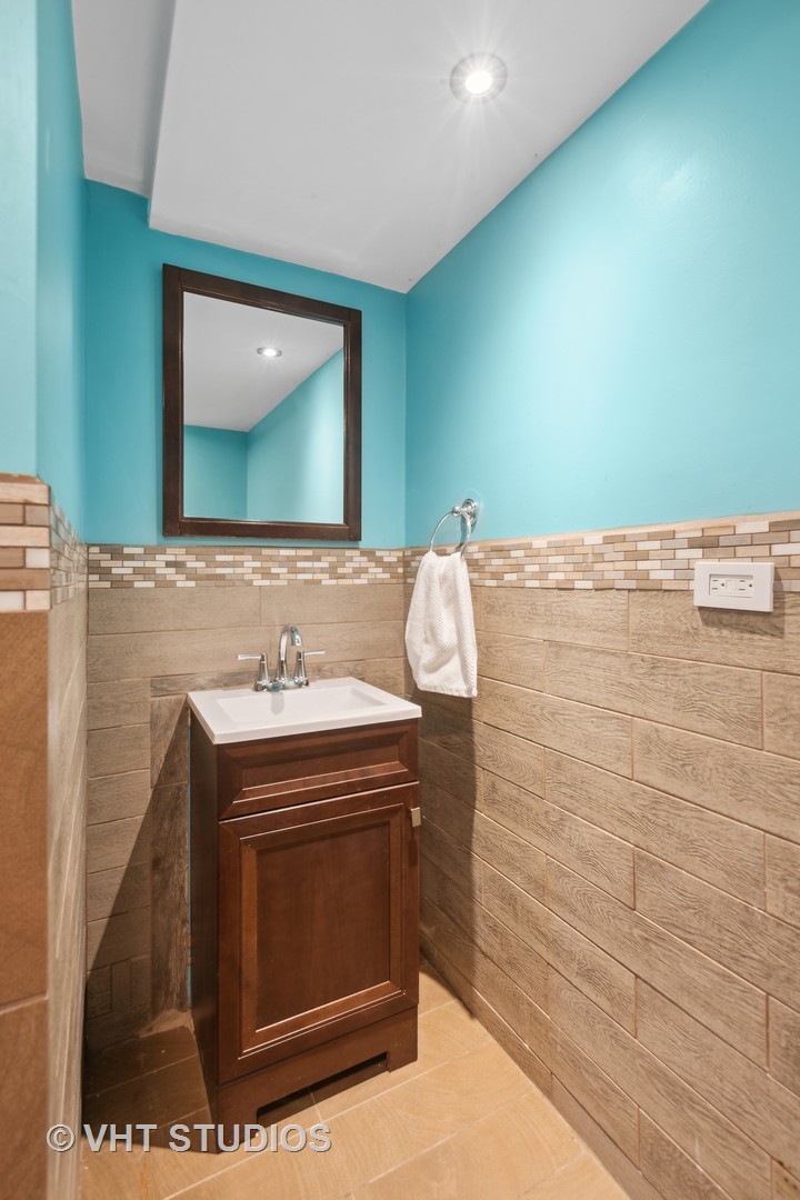353 East Quincy Street Riverside, IL 60546 - Photo 16 of 21 a bathroom with a sink and a mirror