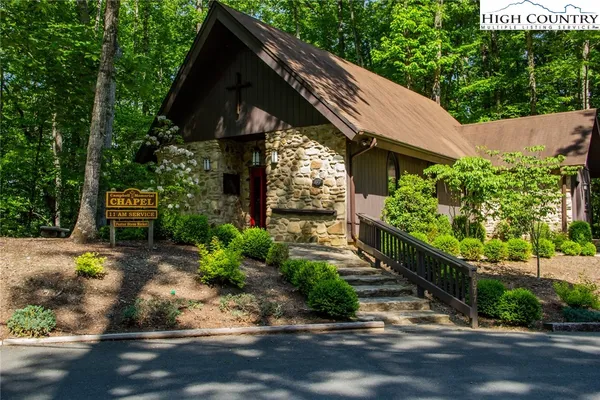 a view of a swimming pool with a lake view