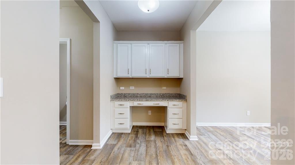 8550 River Ridge Drive Charlotte, NC 28213 - Photo 11 of 25 a view of a livingroom with wooden floor and a fireplace