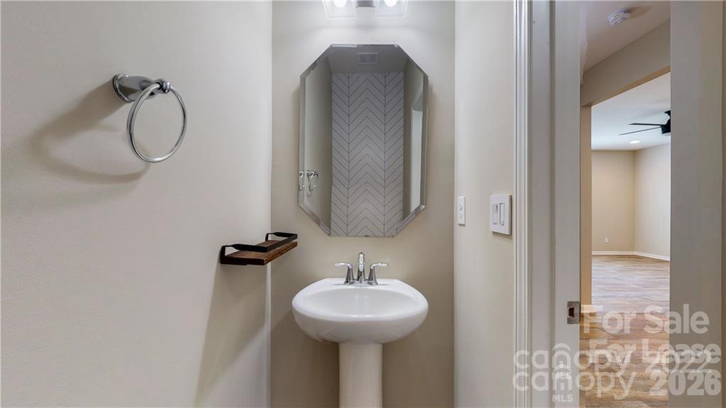 8550 River Ridge Drive Charlotte, NC 28213 - Photo 18 of 25 a bathroom with a sink and a mirror