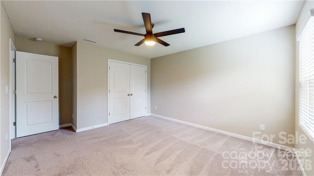 8550 River Ridge Drive Charlotte, NC 28213 - Photo 20 of 25 a view of a livingroom with a ceiling fan and window