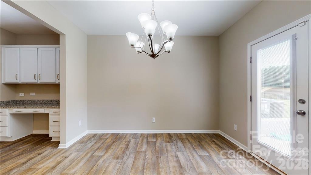 8550 River Ridge Drive Charlotte, NC 28213 - Photo 5 of 25 a view of a livingroom with wooden floor