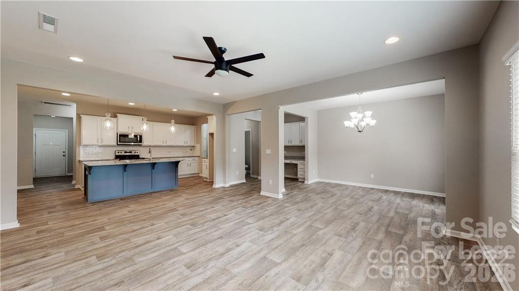8550 River Ridge Drive Charlotte, NC 28213 - Photo 7 of 25 a view of kitchen with wooden floor and window