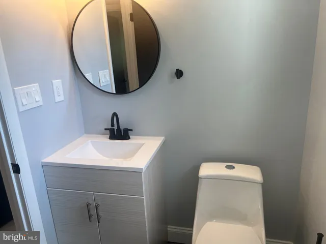 a bathroom with a toilet and a sink