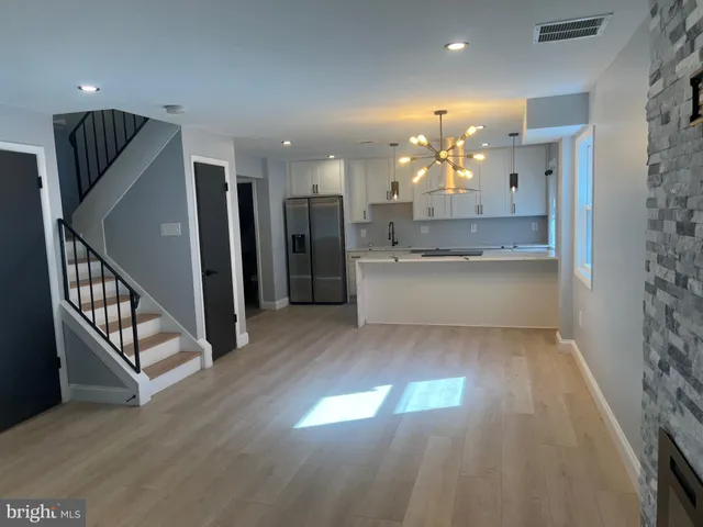 a view of a kitchen and a chandelier