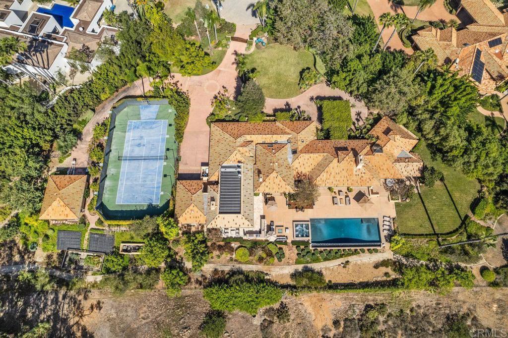 7196 Rancho La Cima Drive Rancho Santa Fe, CA 92067 - Photo 11 of 57 an aerial view of a house with yard swimming pool and outdoor seating