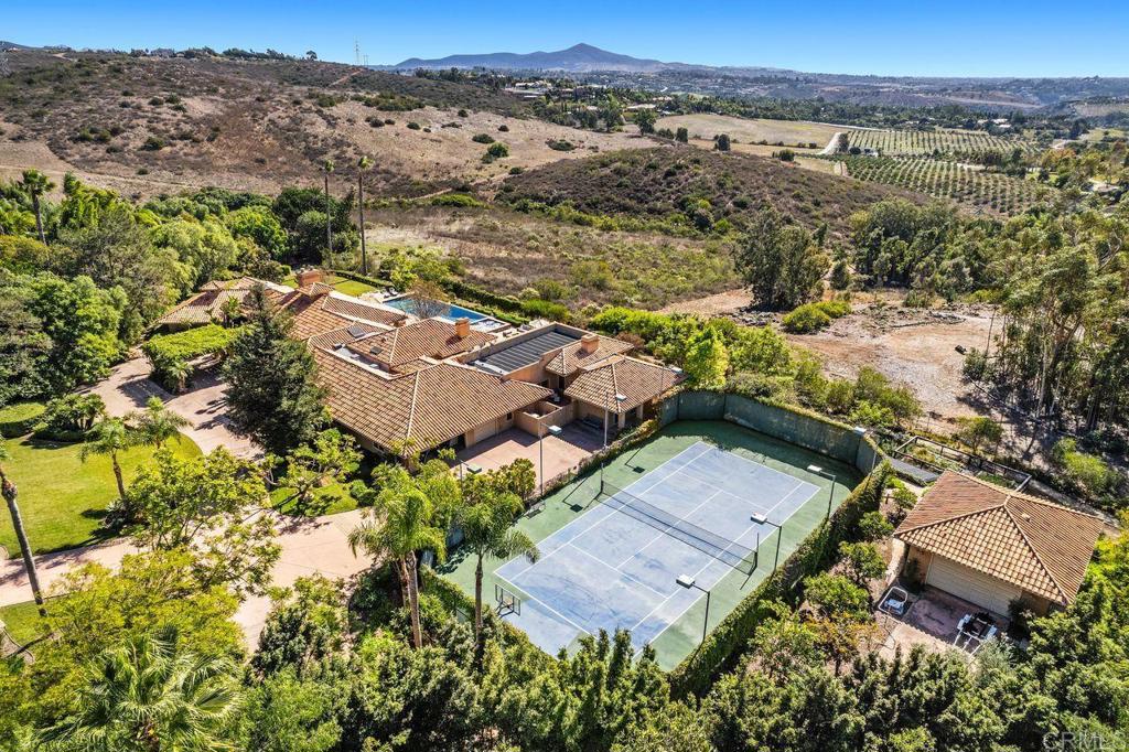 7196 Rancho La Cima Drive Rancho Santa Fe, CA 92067 - Photo 13 of 57 an aerial view of residential houses with outdoor space