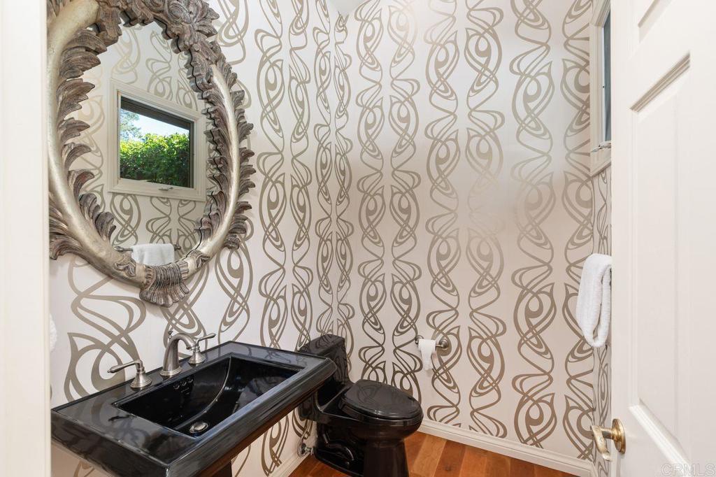 7196 Rancho La Cima Drive Rancho Santa Fe, CA 92067 - Photo 28 of 57 a close up of a wall with a fireplace